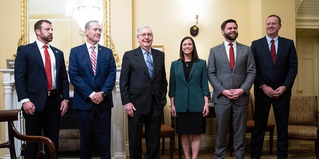 Britt stands alongside other newly elected GOP senators and Senate Minority Leader Mitch McConnell, R-Ky., in his office on Capitol Hill on Tuesday, Nov. 15, 2022 in Washington, DC.