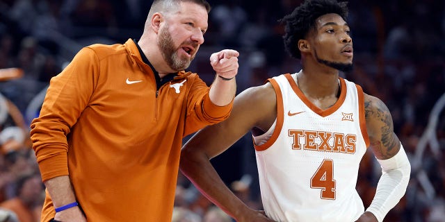 Texas head coach Chris Beard speaks with Texas guard Tyrese Hunter (4) during a game against the Gonzaga Bulldogs at the Moody Center in Austin, Texas on November 16, 2022. 