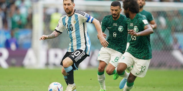 Lionel Messi of Argentina drives the ball during the FIFA World Cup Qatar 2022 Group C match between Argentina and Saudi Arabia at Lusail Stadium on November 22, 2022 in Lusail, Qatar. 