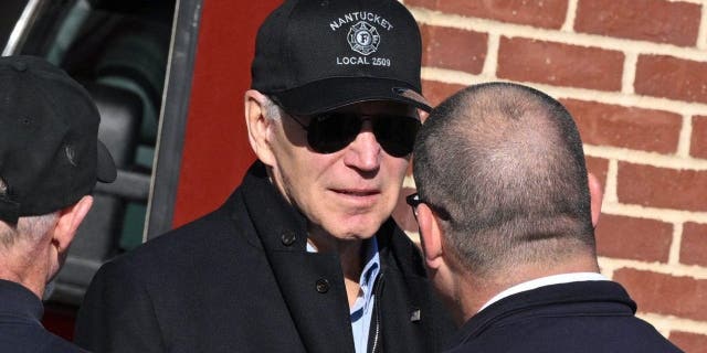 President Biden speaks with firefighters as he visits a Nantucket, Massachusetts, fire station to thank first responders during the Thanksgiving Day holiday, on Nov. 24, 2022.