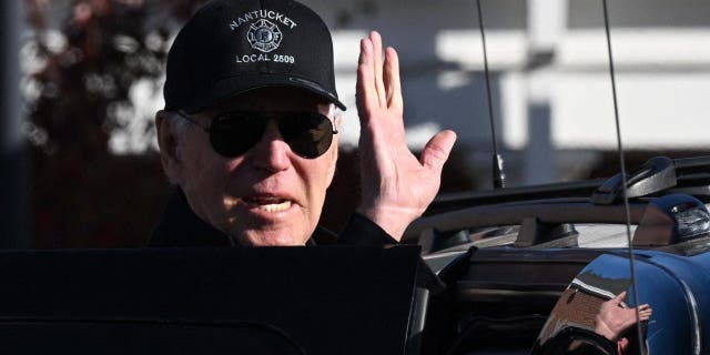 President Biden waves as he leaves a Nantucket, Massachusetts, fire station to thank first responders during the Thanksgiving Day holiday, on Nov. 24, 2022.