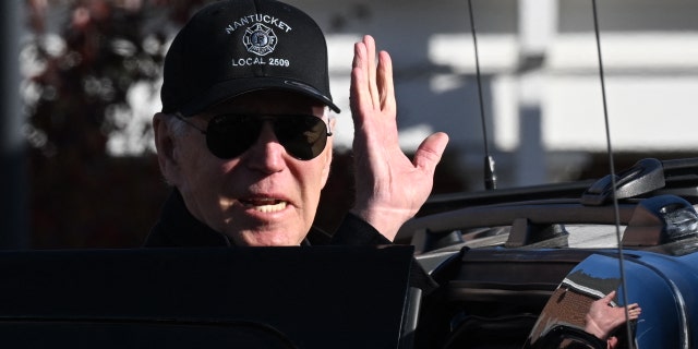 President Biden waves as he leaves after visiting a Nantucket, Massachusetts, fire station to thank first responders during the Thanksgiving Day holiday, on Nov. 24, 2022.