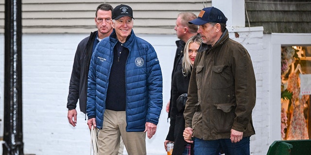 US President Joe Biden walks with Hunter Biden and his wife Melissa Cohen after lunch in Nantucket, Massachusetts on November 25, 2022.