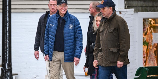 US President Joe Biden walks with Hunter Biden and his wife Melissa Cohen after having lunch in Nantucket, Massachusetts, on November 25, 2022.