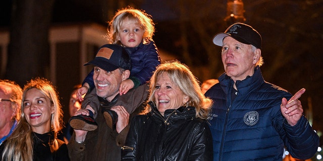 US President Joe Biden watches a Christmas tree lighting ceremony with (R-L) First Lady Jill Biden, son Hunter Biden, grandson Beau, and daughter-in-law Melissa Cohen in Nantucket, Massachusetts, on November 25, 2022. - The President is spending the Thanksgiving holiday with his family in Nantucket. 