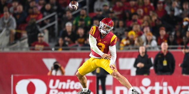 USC Trojans quarterback Caleb Williams throws on the run against the Notre Dame Fighting Irish on November 26, 2022, at the Los Angeles Memorial Coliseum.