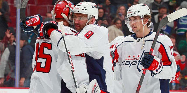 Alex Ovechkin and teammates celebrate their 5-1 win over the Vancouver Canucks on Nov. 29, 2022.