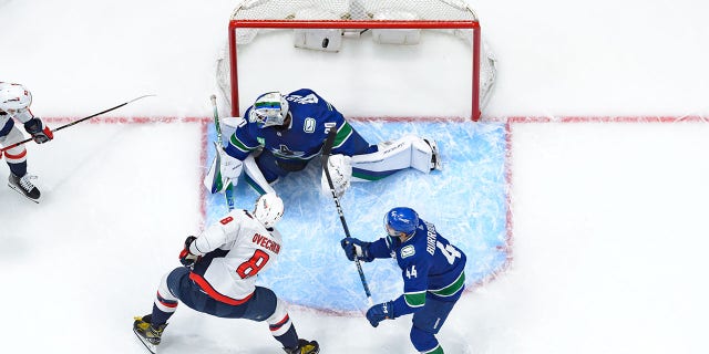 Washington Capitals' Alex Ovechkin scores a goal on Canucks goaltender Spencer Martin on Nov. 29, 2022, in Vancouver.