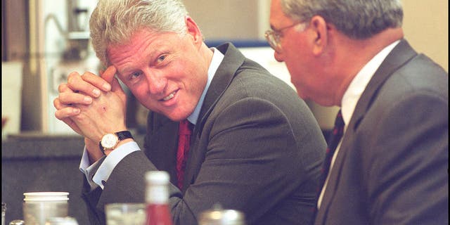 President Bill Clinton talks with Mayor Tom Menino at Mike's City Diner before consuming a plate of eggs, ham and grits, on Jan. 18, 2000. Boston Herald staff photo by Matt Stone.