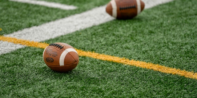 Footballs on the side of the field at Gov. Mifflin High School Stadium in Shillington, Pennsylvania, Aug. 31, 2020.