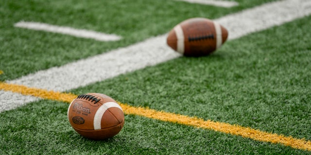 Footballs on the side of the field at Gov. Mifflin High School Stadium in Shillington, Pennsylvania, Aug. 31, 2020.
