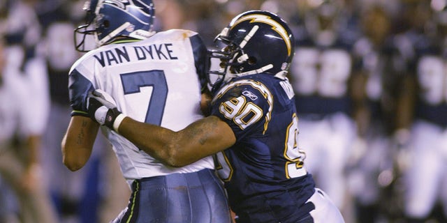 Adrian Dingle of the San Diego Chargers sacks Seattle Seahawks quarterback Ryan Van Dyke during the first half of a preseason game at Qualcomm Stadium in San Diego, California, on Aug. 16, 2002.