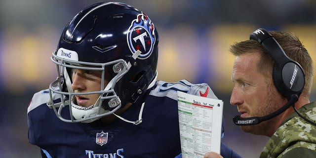 Tennessee Titans Offensive Coordinator Todd Downing chats with Ryan Tannehill, #17, against the Los Angeles Rams during the first quarter at SoFi Stadium No. 7, 2021 in Inglewood, California.