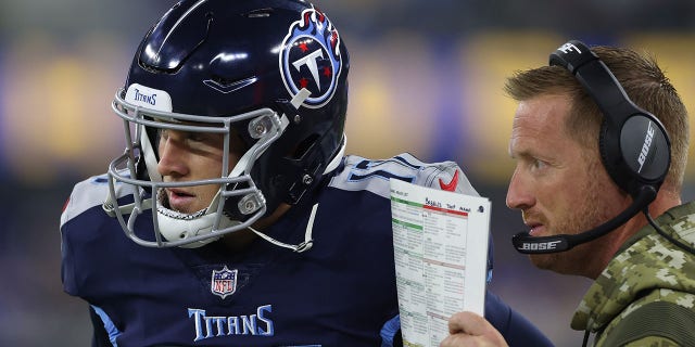 Tennessee Titans Offensive Coordinator Todd Downing chats with Ryan Tannehill, #17, against the Los Angeles Rams during the first quarter at SoFi Stadium No. 7, 2021 in Inglewood, California.