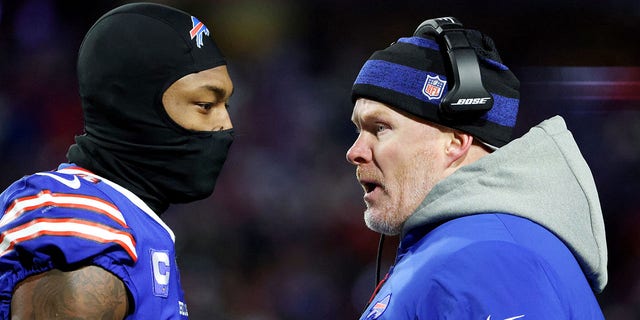 Stefon Diggs of the Buffalo Bills talks with head coach Sean McDermott during the New England Patriots game at Highmark Stadium on Dec. 6, 2021, in Orchard Park, New York.