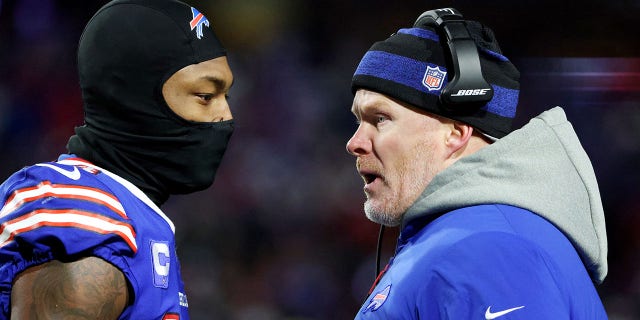 Stefon Diggs talks with head coach Sean McDermott