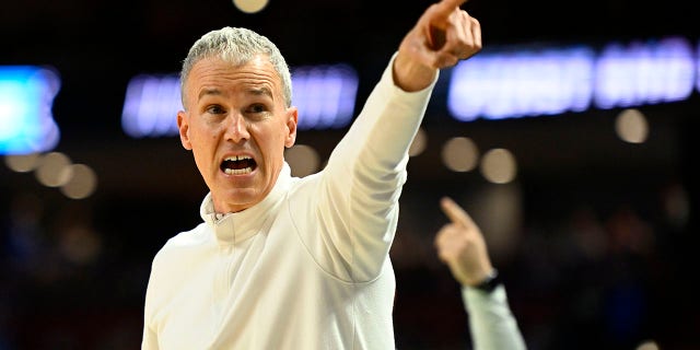 Head coach Andy Enfield of the USC Trojans reacts to a call against the Miami Hurricanes during the second half in the first round game of the 2022 NCAA Men's Basketball Tournament at Bon Secours Wellness Arena on March 18, 2022 in Greenville, South Carolina.