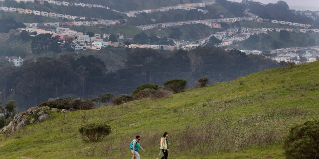 Day hikers explore the view from Philosopher's Way, a 2.7 mile loop trail that was officially dedicated at McLaren Park in San Francisco on Jan. 5, 2013.