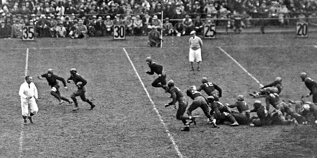 Jack Chevigny of Notre Dame makes a 25-yard gain in the game against Army at Yankee Stadium in New York on Nov. 10, 1928. Earlier, Knute Rockne gave his famous,