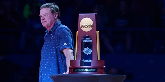 Kansas Jayhawks head coach Bill Self stands next to the 2022 Men's NCAA basketball National Championship trophy during Late Night in the Phog at Allen Fieldhouse on Oct. 14, 2022 in Lawrence, Kansas. 