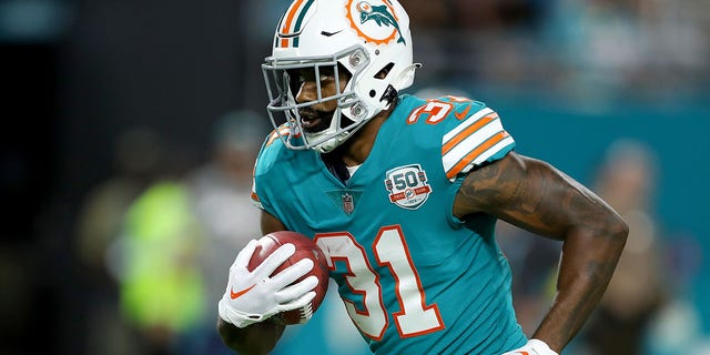Raheem Mostert of the Miami Dolphins rushes against the Pittsburgh Steelers during the first quarter at Hard Rock Stadium Oct. 23, 2022, in Miami Gardens, Fla. 