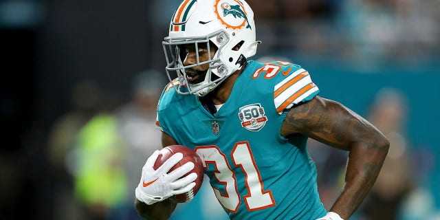 Raheem Mostert of the Miami Dolphins rushes against the Pittsburgh Steelers during the first quarter at Hard Rock Stadium Oct. 23, 2022, in Miami Gardens, Fla. 