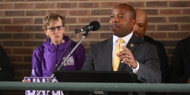 Milwaukee Mayor Cavalier Johnson speaks to participants at a stop during a march to get voting on the first day of early voting in the 2022 midterm elections on October 25, 2022.