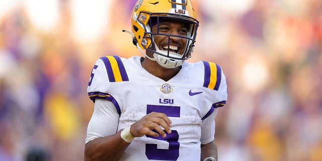 Jayden Daniels of the LSU Tigers celebrates a touchdown during the second half against the Mississippi Rebels at Tiger Stadium Oct. 22, 2022, in Baton Rouge, La. 