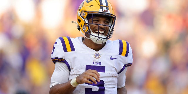 Jayden Daniels of the LSU Tigers celebrates a touchdown during the second half against the Mississippi Rebels at Tiger Stadium Oct. 22, 2022, in Baton Rouge, La.