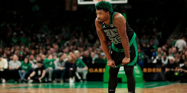Marcus Smart, #36 of the Boston Celtics, looks on against the Washington Wizards during the first quarter at TD Garden on October 30, 2022 in Boston.