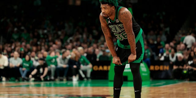 Marcus Smart, #36 of the Boston Celtics, looks on against the Washington Wizards during the first quarter at TD Garden on October 30, 2022 in Boston.