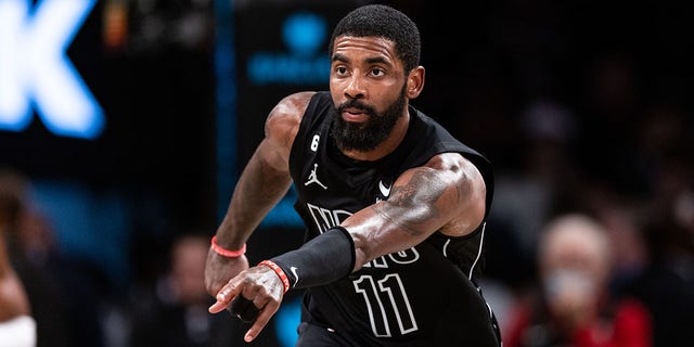 Kyrie Irving of the Brooklyn Nets points during the fourth quarter of a game against the Indiana Pacers at Barclays Center Oct. 31, 2022, in New York City.