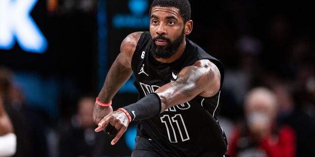 Kyrie Irving #11 of the Brooklyn Nets points during the fourth quarter of the game against the Indiana Pacers at Barclays Center on October 31, 2022 in New York City.  