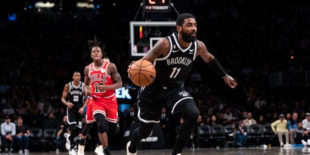 Kyrie Irving, #11 of the Brooklyn Nets, brings the ball up the court during the third quarter of the game against the Chicago Bulls at Barclays Center on Nov. 1, 2022 in New York City.