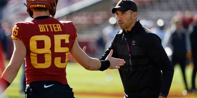 Head coach Matt Campbell of the Iowa State Cyclones shakes hands with wide receiver Aidan Bitter (85) in pregame warmups at Jack Trice Stadium Nov. 5, 2022, in Ames, Iowa.