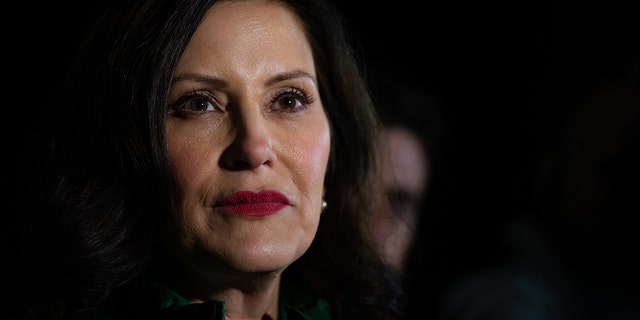 Michigan Gov. Gretchen Whitmer listens to reporters during a news conference on Nov. 7, 2022, in East Lansing, Michigan. 