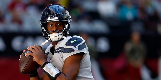 Quarterback Geno Smith #7 of the Seattle Seahawks warms up before the game against the Arizona Cardinals at State Farm Stadium on November 06, 2022 in Glendale, Arizona. The Seahawks beat the Cardinals 31-21. 