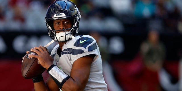 Quarterback Geno Smith of the Seattle Seahawks warms up before a game against the Arizona Cardinals at State Farm Stadium Nov. 6, 2022, in Glendale, Ariz.