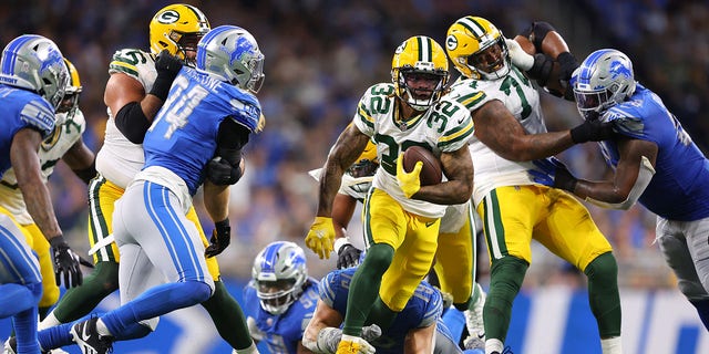 Kylin Hill, #32 of the Green Bay Packers, rushes against the Detroit Lions during the second half at Ford Field on Nov. 6, 2022 in Detroit.