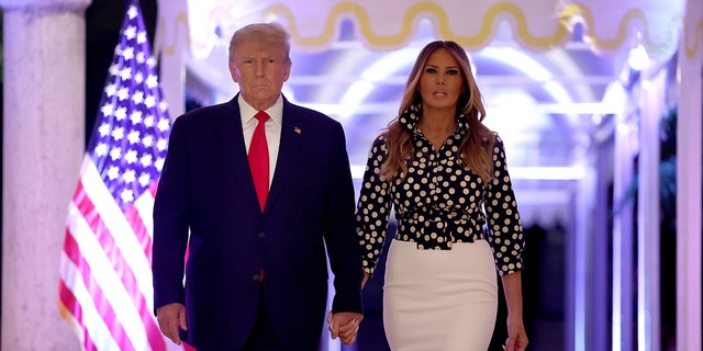 Former U.S. President Donald Trump and former first lady Melania Trump arrive for an event at his Mar-a-Lago home on November 15, 2022 in Palm Beach, Florida. 