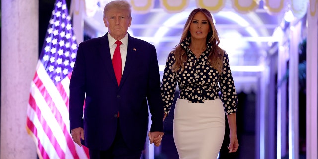 Former U.S. President Donald Trump and former first lady Melania Trump arrive for an event at his Mar-a-Lago home on November 15, 2022 in Palm Beach, Florida. 