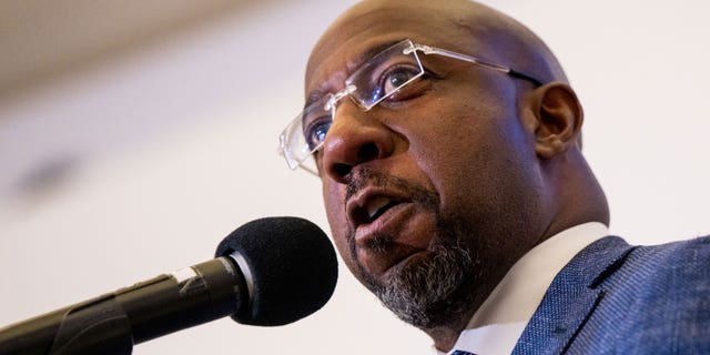 Sen.  Raphael Warnock speaks at a campaign rally at the Tubman Museum on Nov. 17, 2022, in Macon, Georgia.