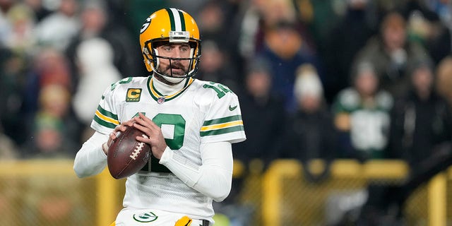 Aaron Rodgers of the Green Bay Packers looks to throw a pass against the Tennessee Titans during the first quarter in a game at Lambeau Field on November 17, 2022 in Green Bay, Wisconsin. 
