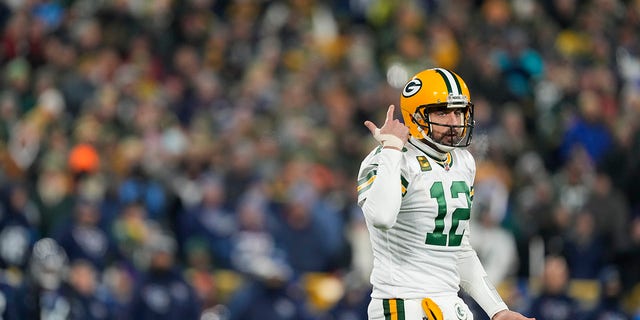 Aaron Rodgers #12 of the Green Bay Packers reacts after the play against the Tennessee Titans during the first quarter of the game at Lambeau Field on November 17, 2022 in Green Bay, Wisconsin. 