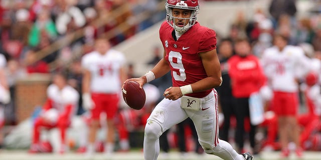 Bryce Young, #9 of the Alabama Crimson Tide, comes out of the pocket while looking to pass against the Austin Peay Governors during the second half at Bryant-Denny Stadium on November 19, 2022 in Tuscaloosa, Alabama. 