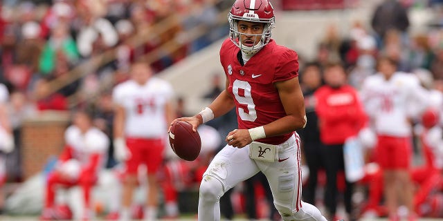 Bryce Young, #9 of the Alabama Crimson Tide, comes out of the pocket while looking to pass against the Austin Peay Governors during the second half at Bryant-Denny Stadium on November 19, 2022 in Tuscaloosa, Alabama. 