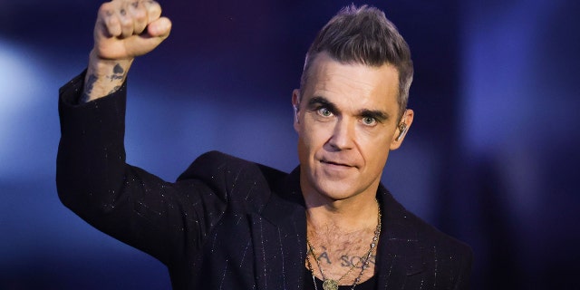 Robbie Williams defended his decision to perform at the World Cup in Qatar.