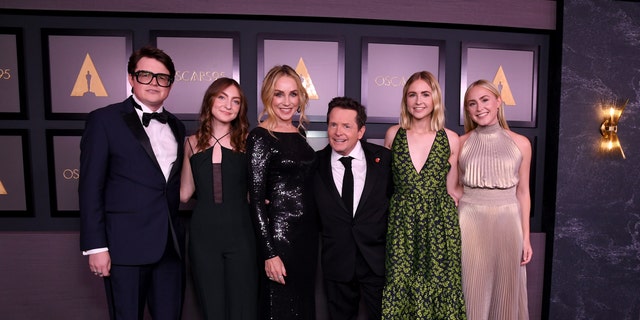 Michael J. Fox alongside his wife Tracy Pollan and children (L-R) Sam Fox, Esmé Fox, Aquinnah Fox, and Schuyler Fox attended the Academy of Motion Picture Arts and Sciences 13th Governors Awards.