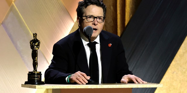 Michael J. Fox gives a speech at the podium at the Governors Award