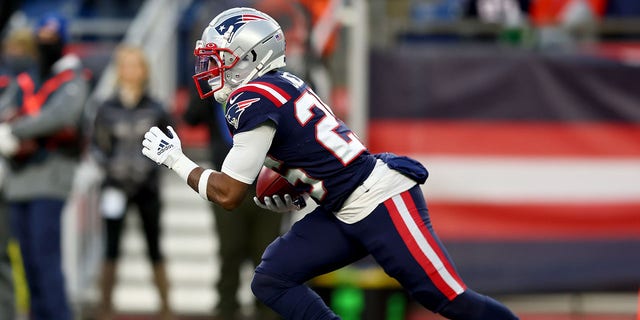 Marcus Jones of the New England Patriots returns a punt for a touchdown against the New York Jets during the fourth quarter at Gillette Stadium on Nov. 20, 2022, in Foxborough, Massachusetts.